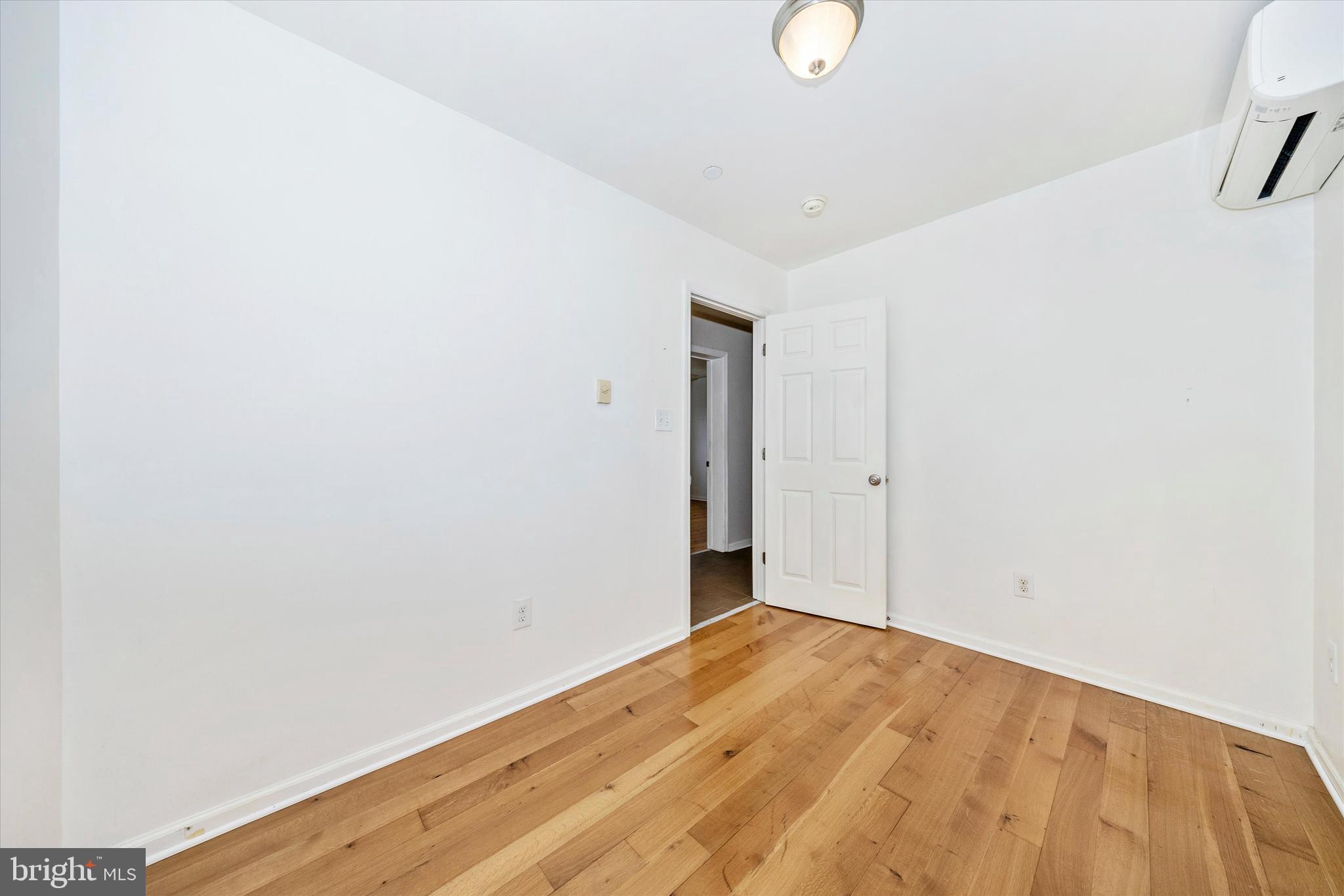 9930 Woodsboro Road Frederick, MD 21701 - Photo 28 of 58 a view of empty room with wooden floor