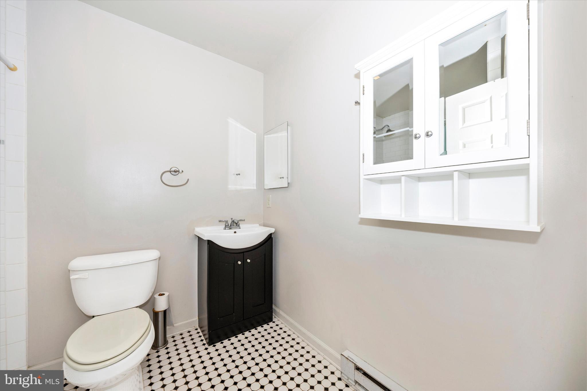 9930 Woodsboro Road Frederick, MD 21701 - Photo 29 of 58 a bathroom with a toilet a sink and a window