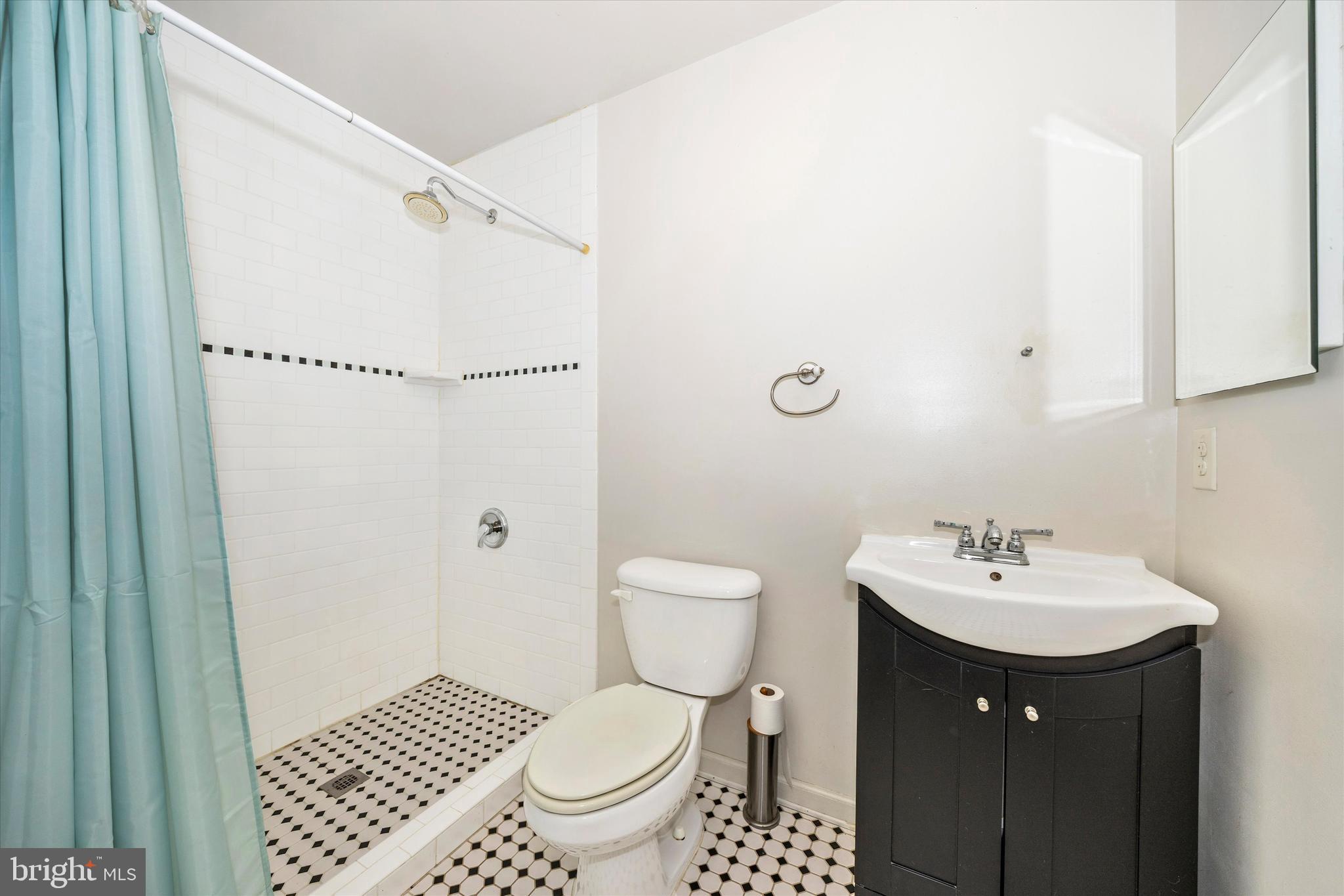 9930 Woodsboro Road Frederick, MD 21701 - Photo 30 of 58 a bathroom with a sink toilet and a mirror