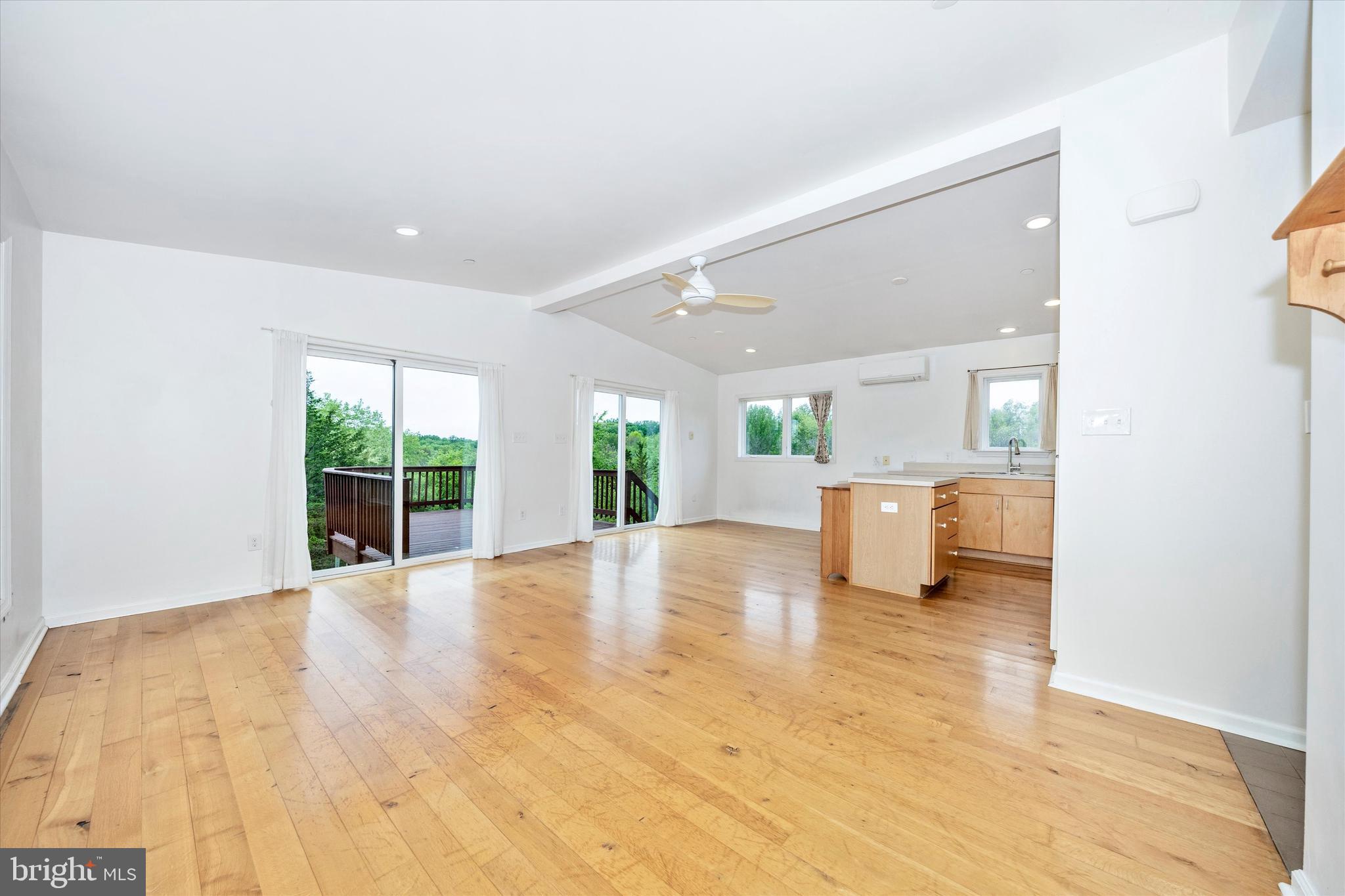 9930 Woodsboro Road Frederick, MD 21701 - Photo 4 of 58 a view of a kitchen with furniture and floor to ceiling window