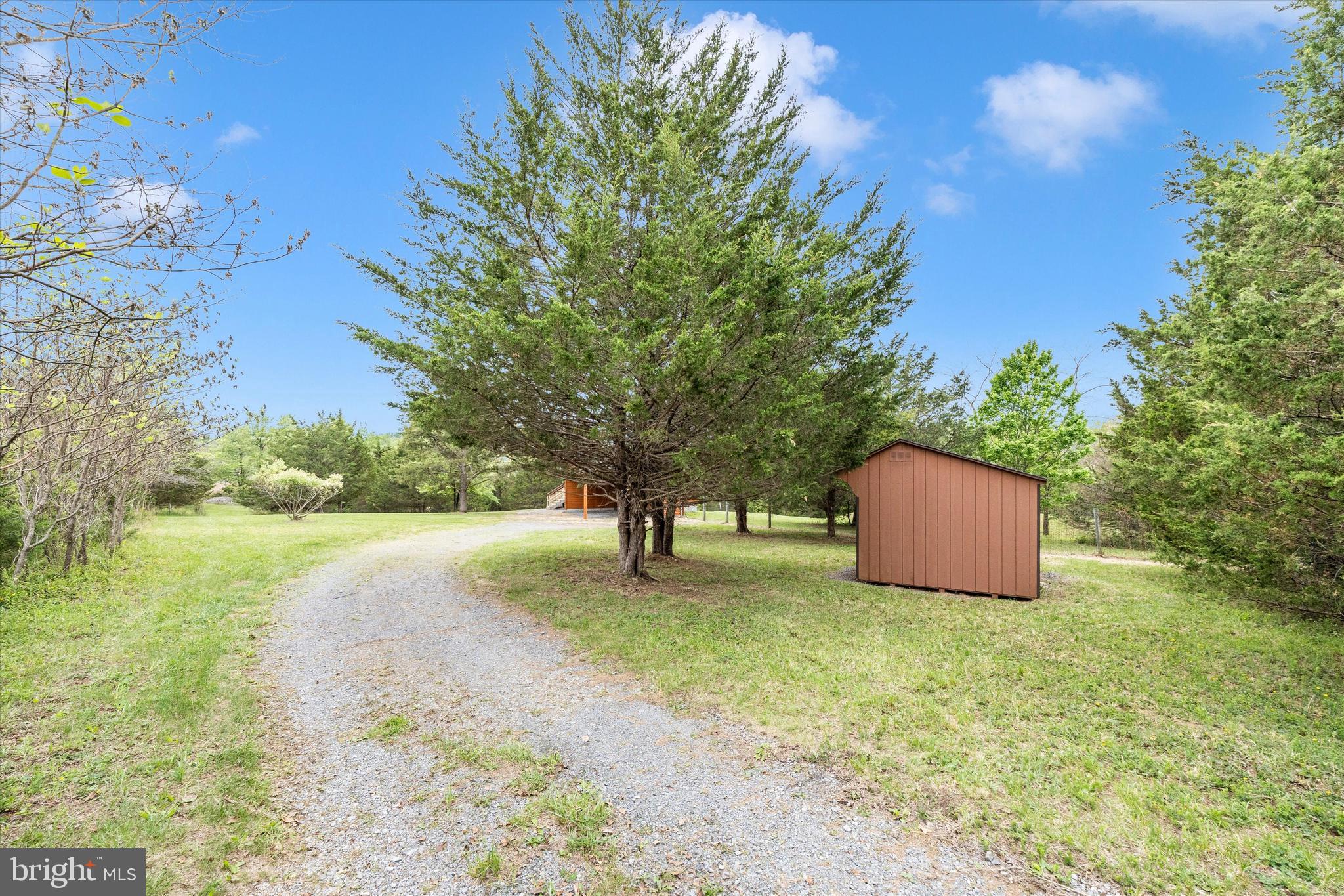 9930 Woodsboro Road Frederick, MD 21701 - Photo 44 of 58 a view of an outdoor space and a yard