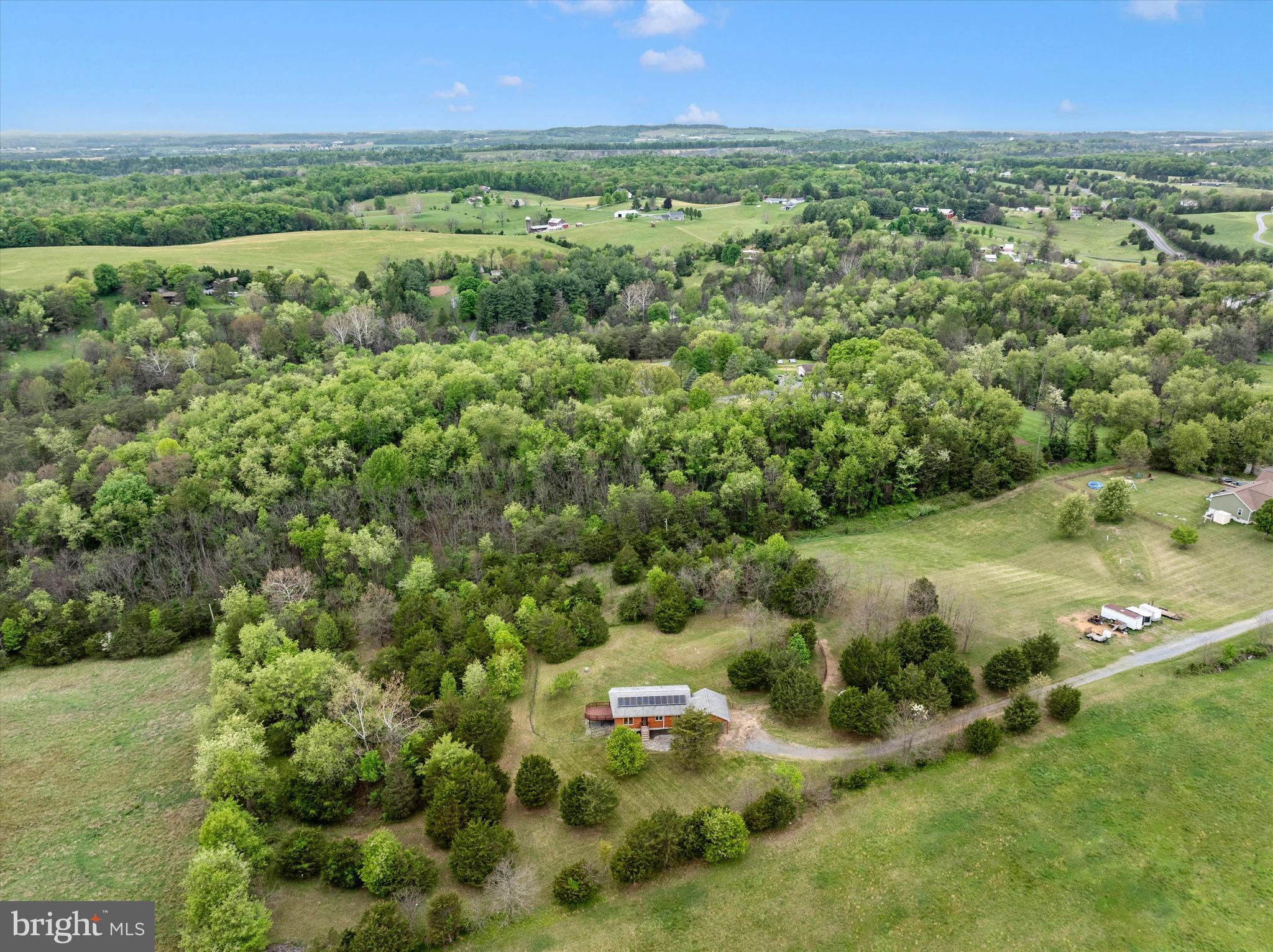 9930 Woodsboro Road Frederick, MD 21701 - Photo 51 of 58 a view of a city with lush green forest