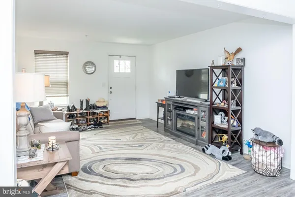 a room with furniture and a flat screen tv