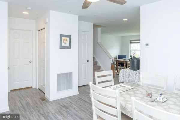 a view of kitchen with furniture and wooden floor