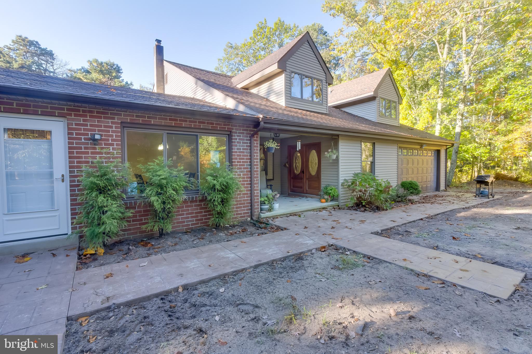 83 Grassy Lake Road Shamong, NJ 08088 - Photo 2 of 48 a front view of a house with garden