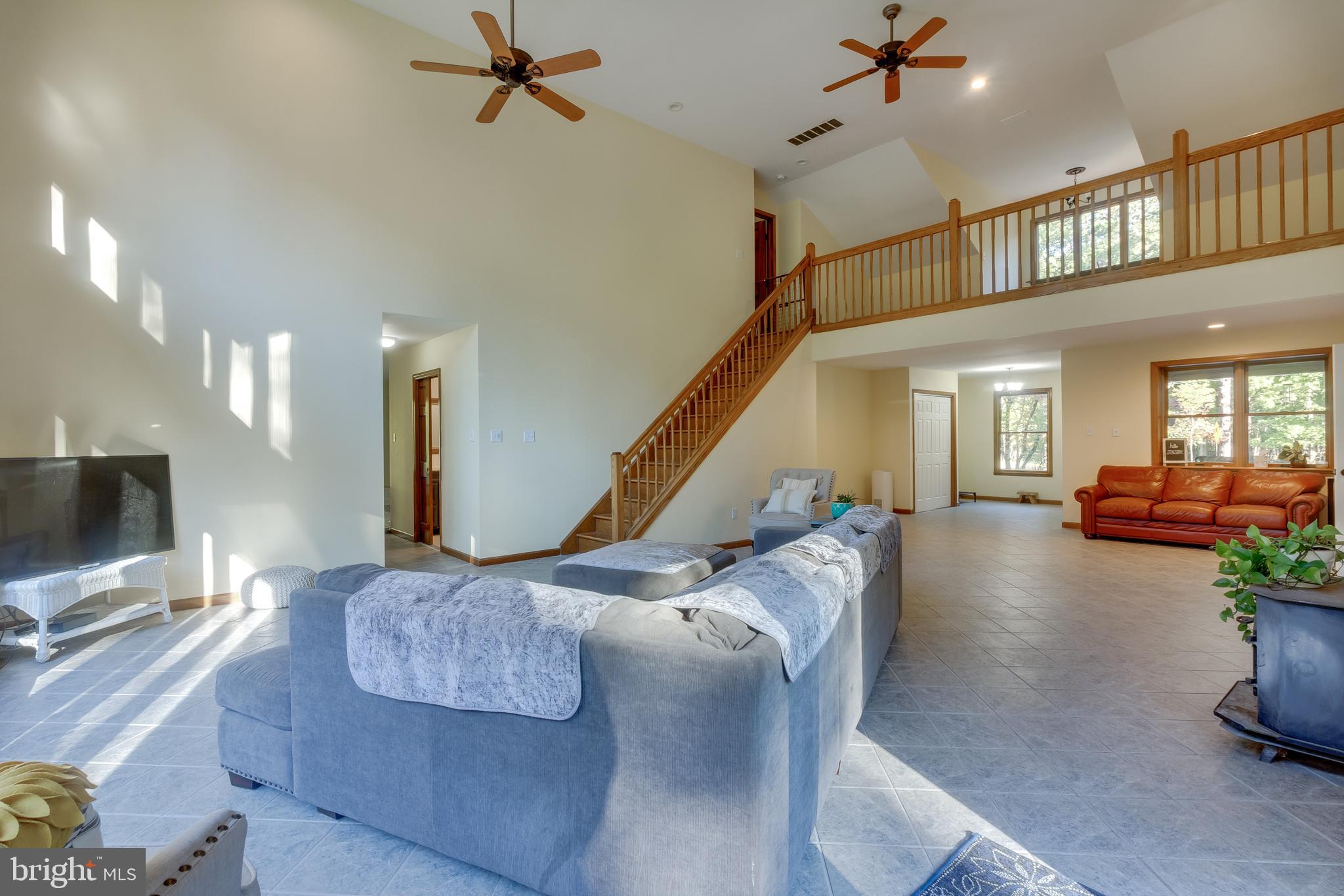 83 Grassy Lake Road Shamong, NJ 08088 - Photo 11 of 48 a living room with furniture and a flat screen tv