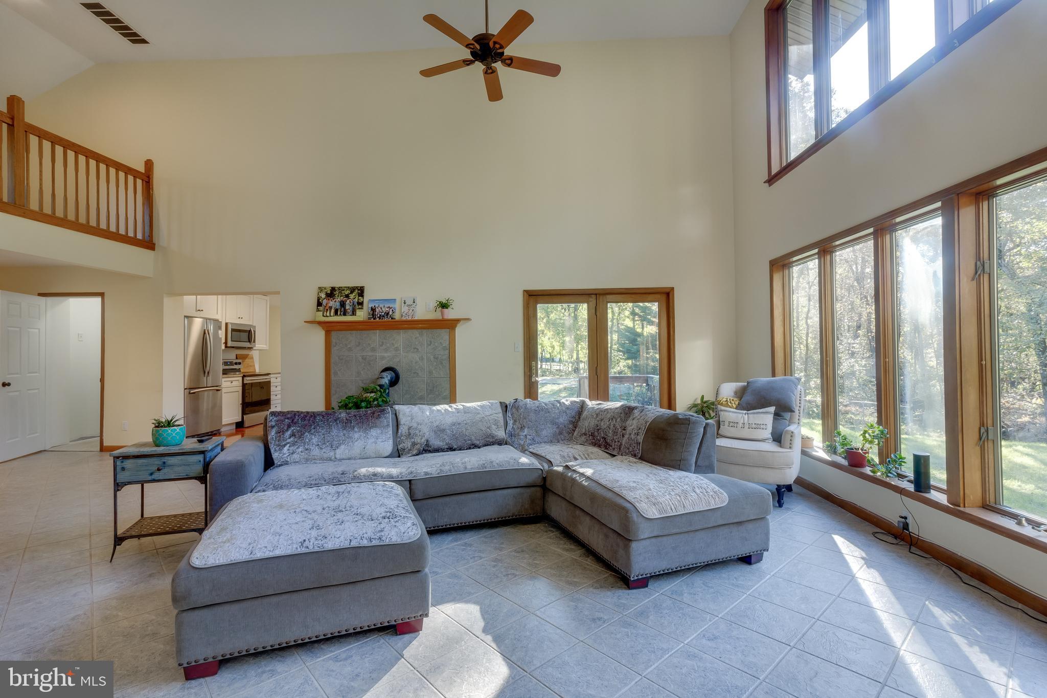 83 Grassy Lake Road Shamong, NJ 08088 - Photo 12 of 48 a living room with furniture and a large window
