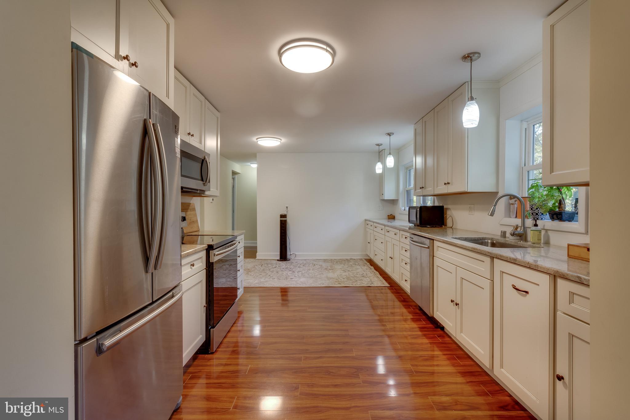 83 Grassy Lake Road Shamong, NJ 08088 - Photo 13 of 48 a large kitchen with stainless steel appliances a refrigerator and a sink