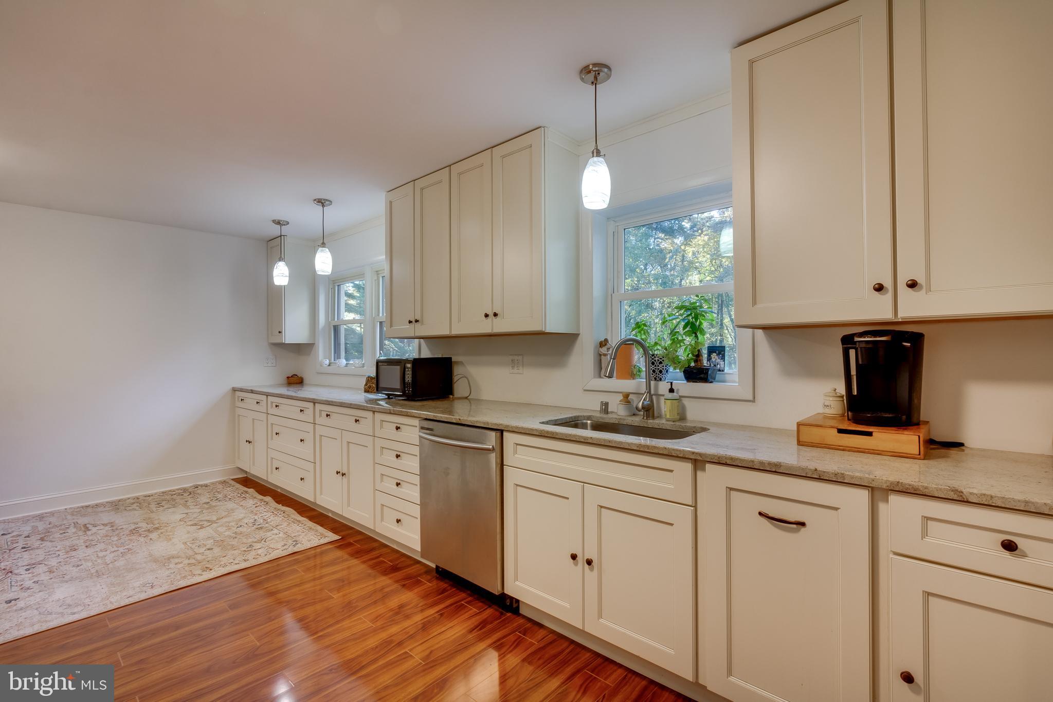 83 Grassy Lake Road Shamong, NJ 08088 - Photo 14 of 48 a kitchen with white cabinets white appliances and sink
