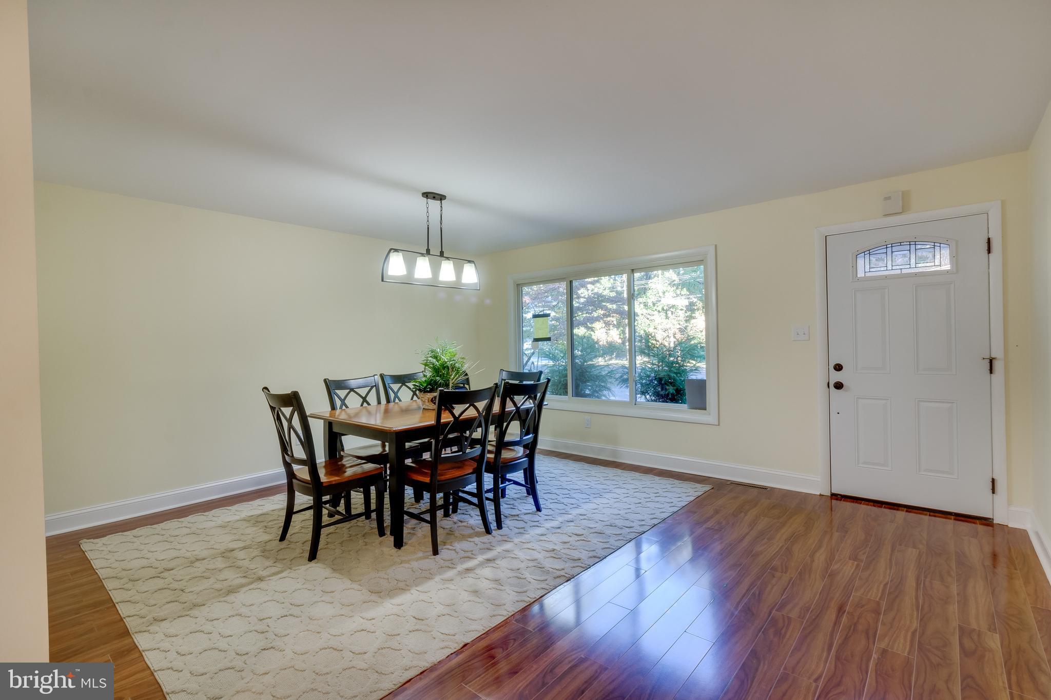 83 Grassy Lake Road Shamong, NJ 08088 - Photo 15 of 48 a view of a dining room with furniture window and wooden floor
