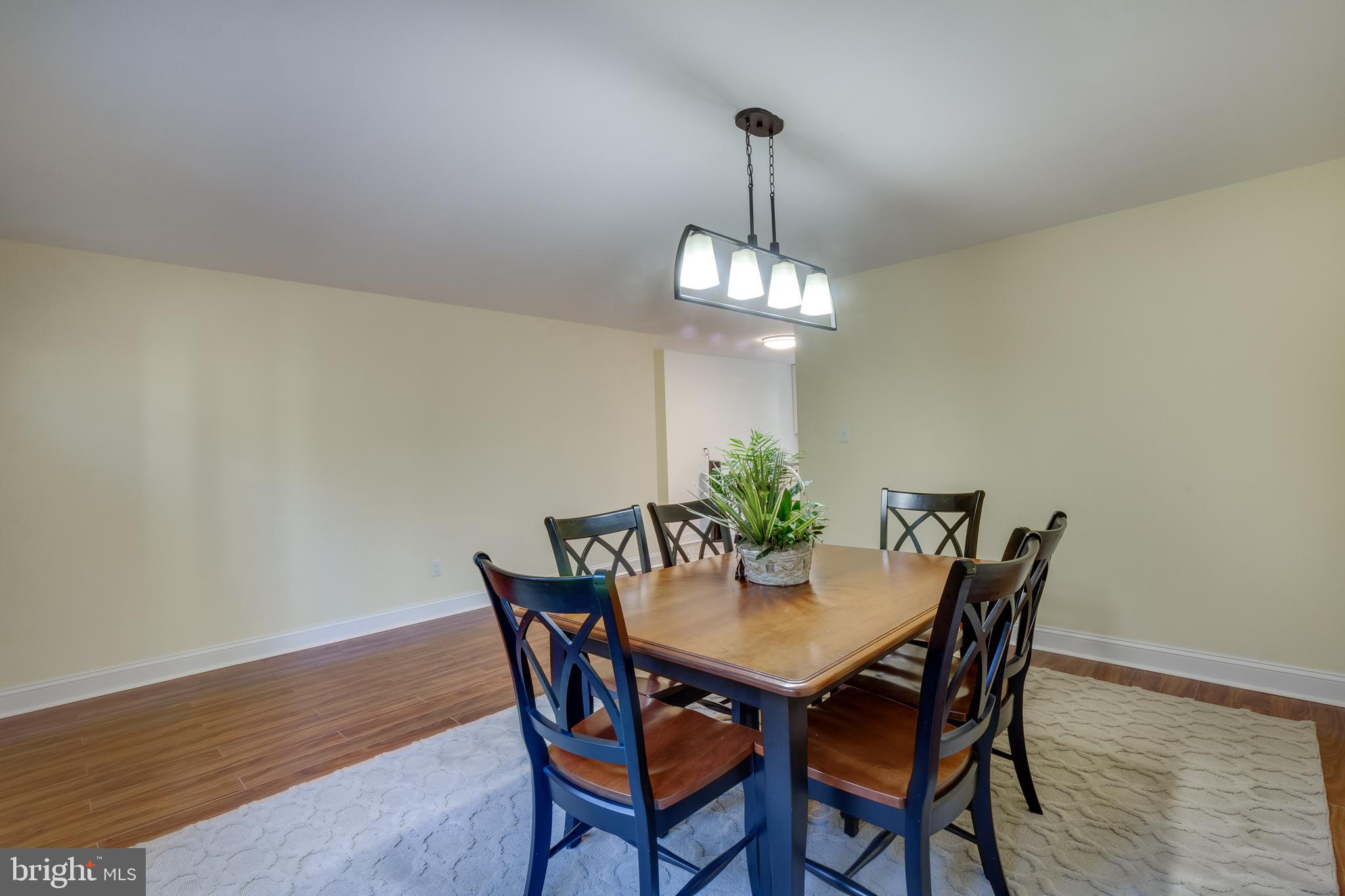 83 Grassy Lake Road Shamong, NJ 08088 - Photo 16 of 48 a view of a dining room with furniture and wooden floor
