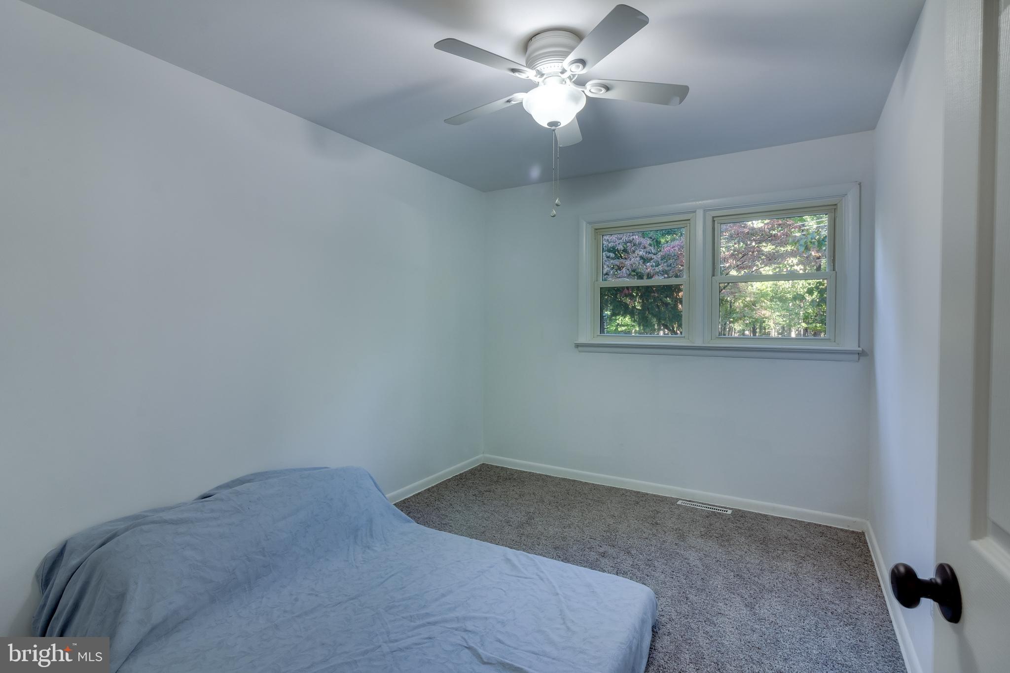 83 Grassy Lake Road Shamong, NJ 08088 - Photo 17 of 48 a view of room with a ceiling fan and a window