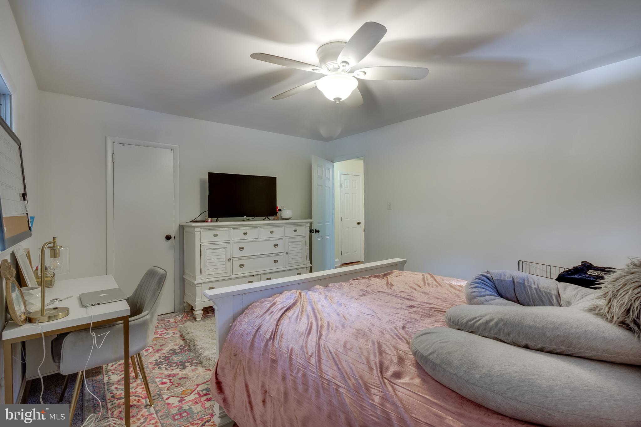 83 Grassy Lake Road Shamong, NJ 08088 - Photo 20 of 48 a bedroom with furniture and a flat screen tv
