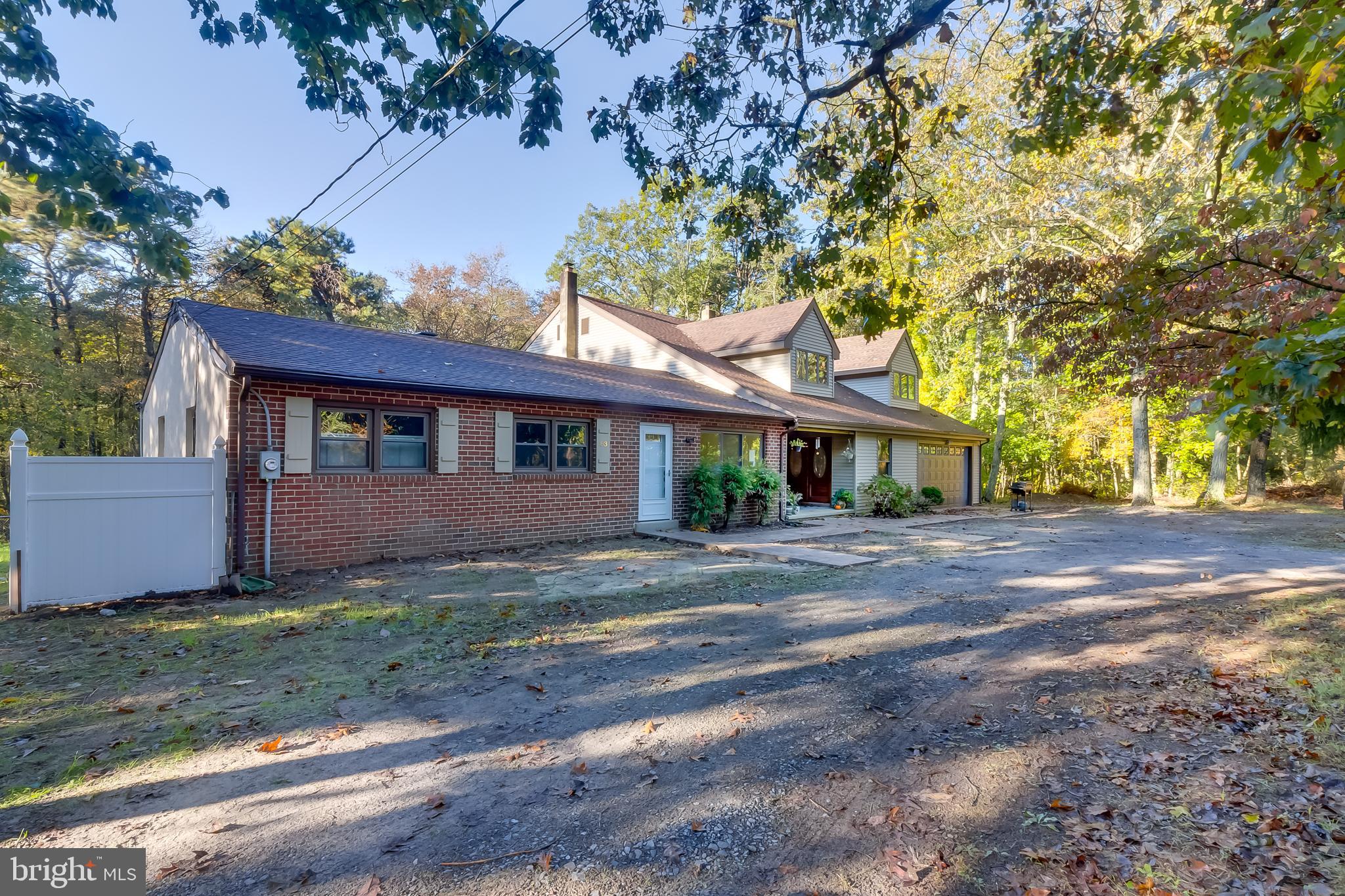 83 Grassy Lake Road Shamong, NJ 08088 - Photo 3 of 48 a front view of a house with a garden