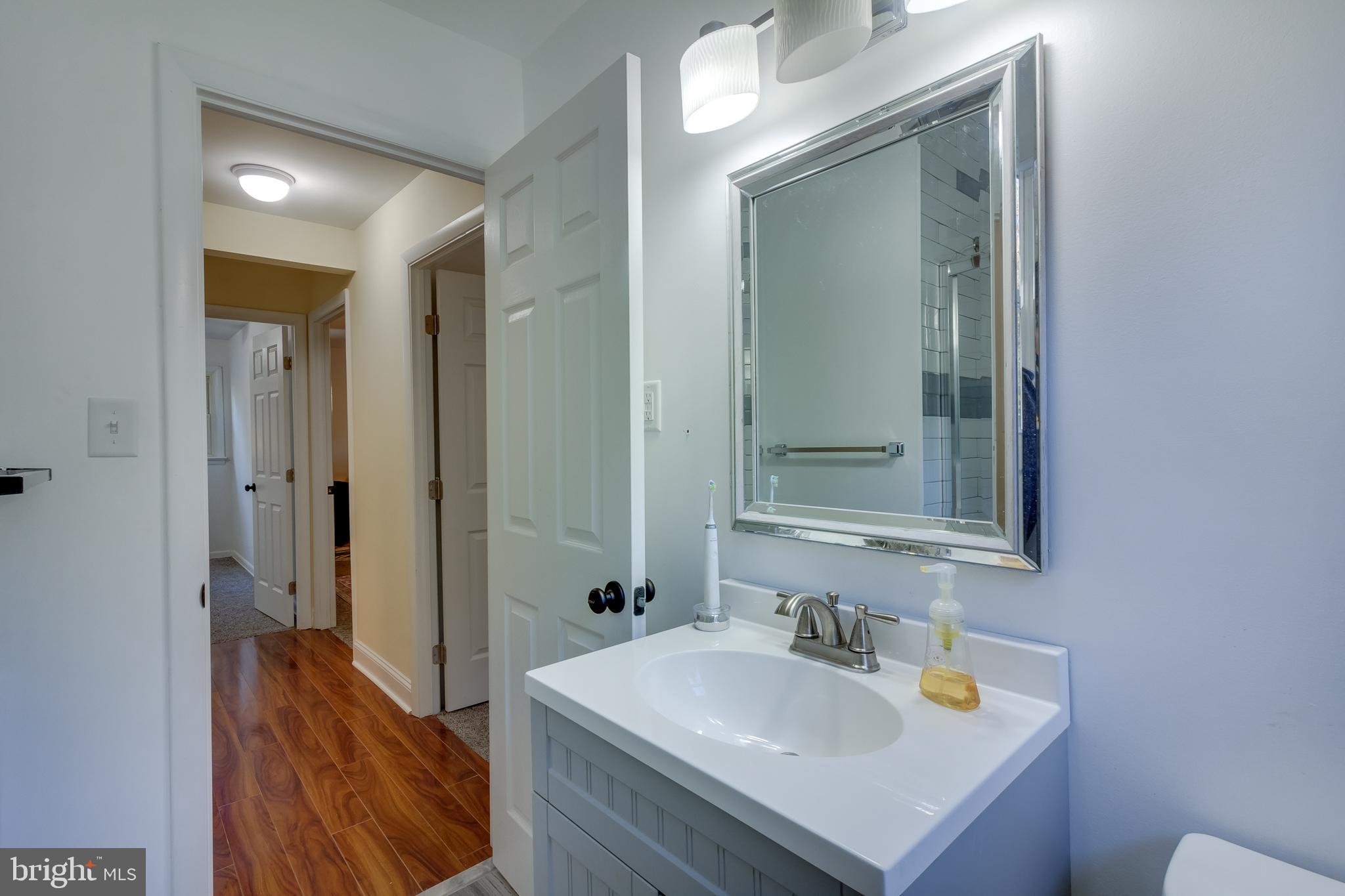83 Grassy Lake Road Shamong, NJ 08088 - Photo 24 of 48 a bathroom with a sink and a mirror