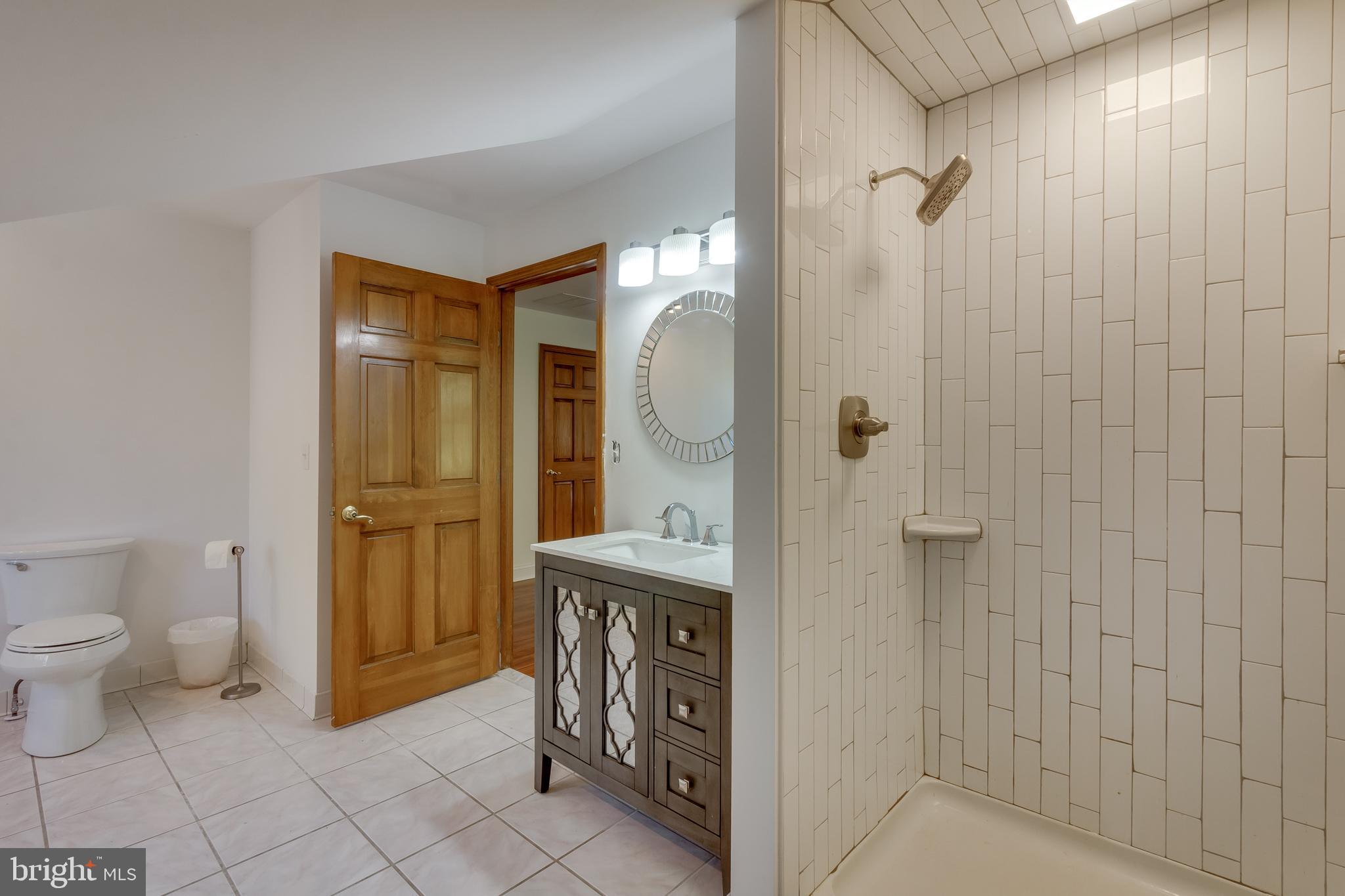 83 Grassy Lake Road Shamong, NJ 08088 - Photo 28 of 48 a spacious bathroom with a granite countertop sink a toilet and shower