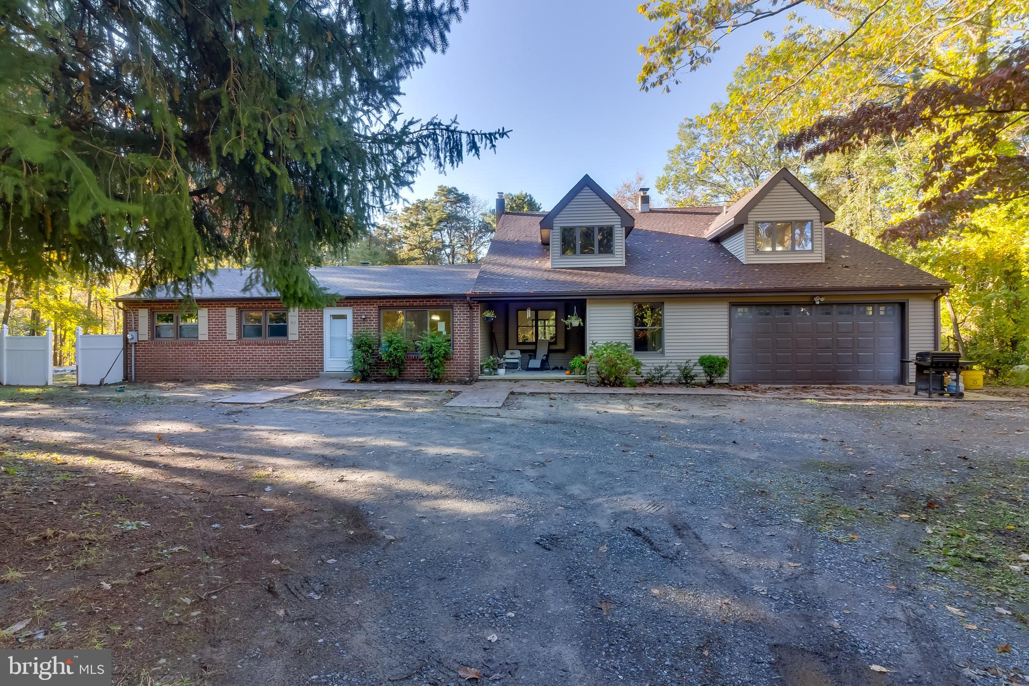83 Grassy Lake Road Shamong, NJ 08088 - Photo 4 of 48 a front view of a house with garden
