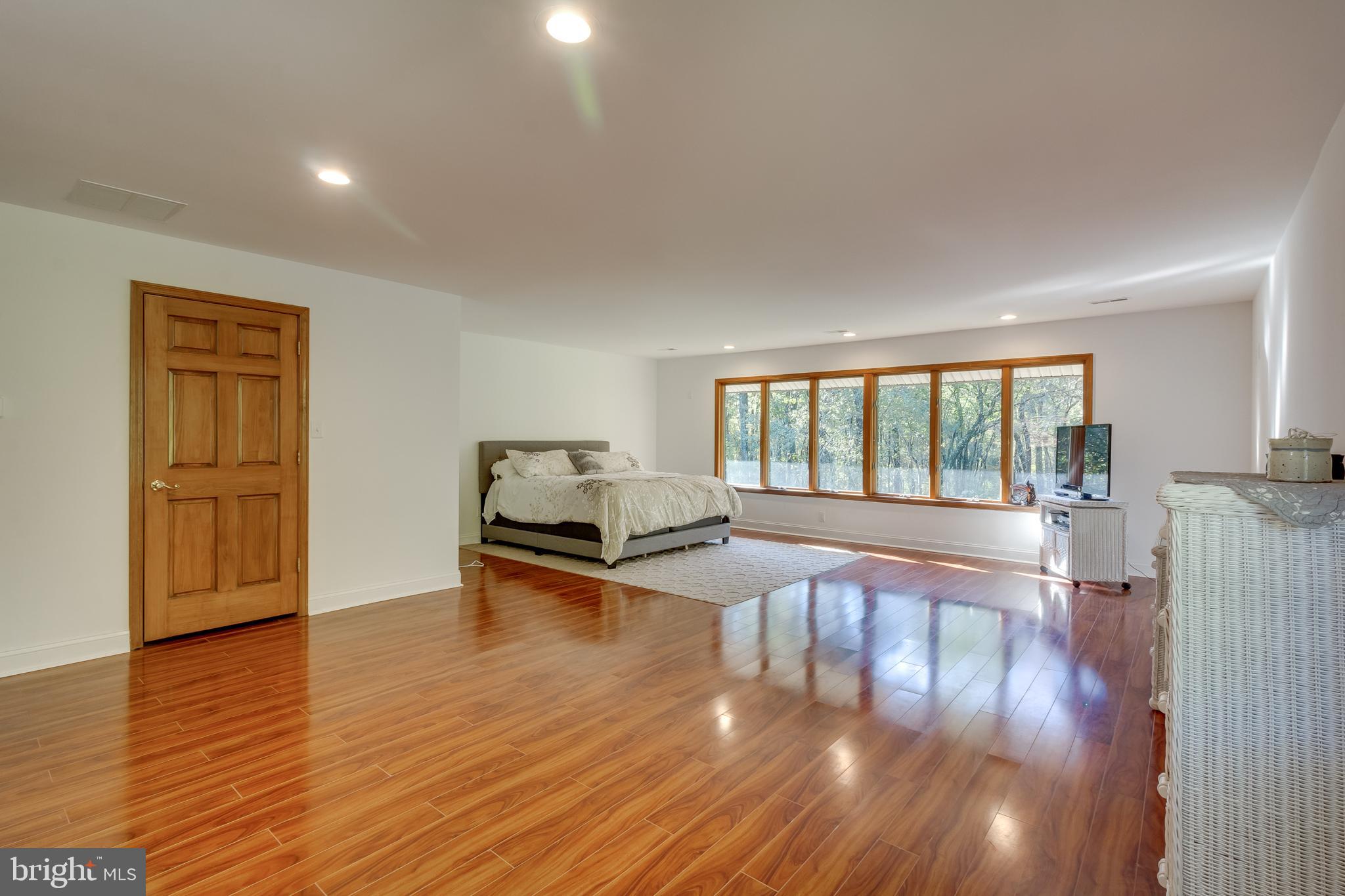 83 Grassy Lake Road Shamong, NJ 08088 - Photo 34 of 48 a view of empty room with wooden floor and fan
