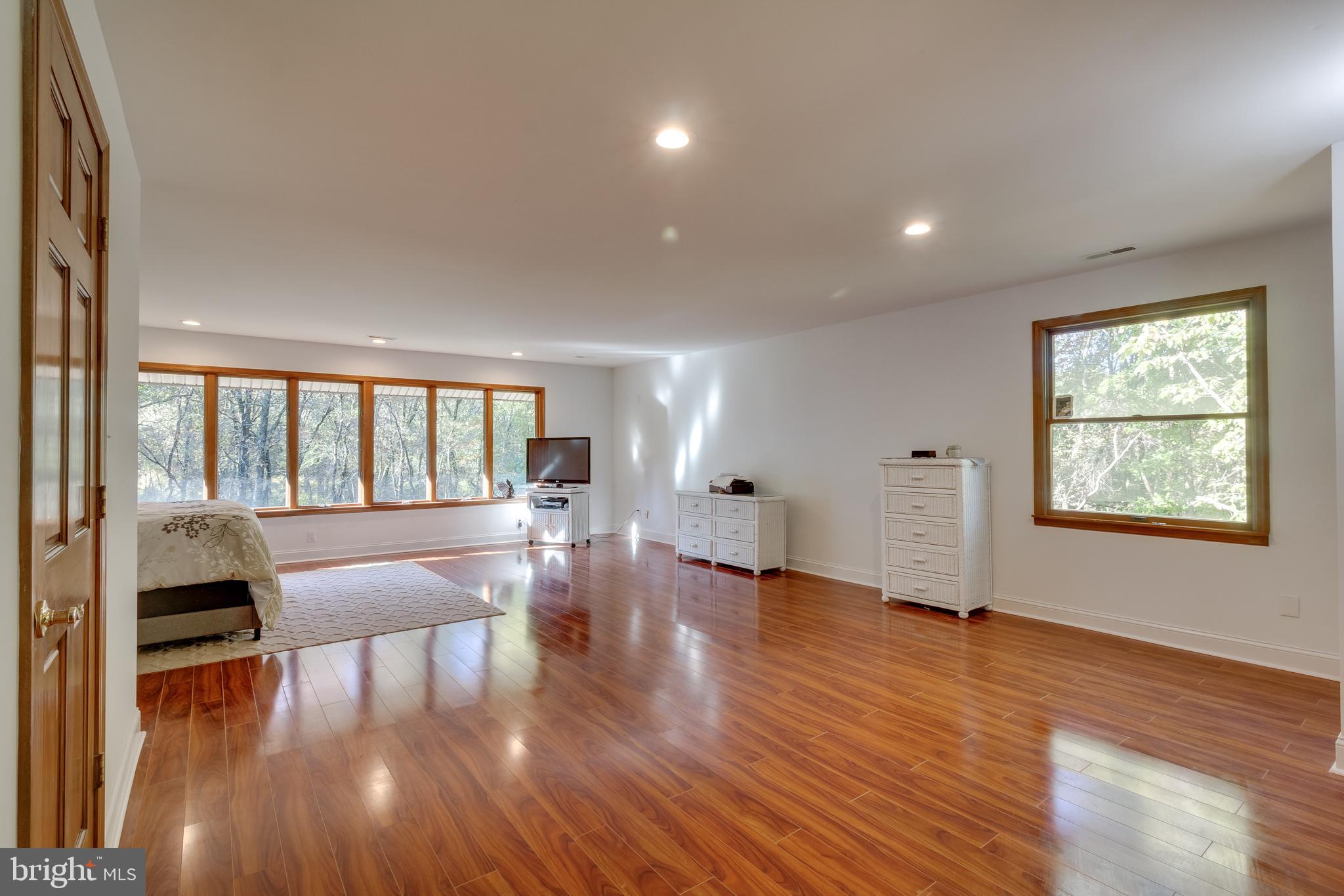 83 Grassy Lake Road Shamong, NJ 08088 - Photo 35 of 48 a living room with furniture and a wooden floor