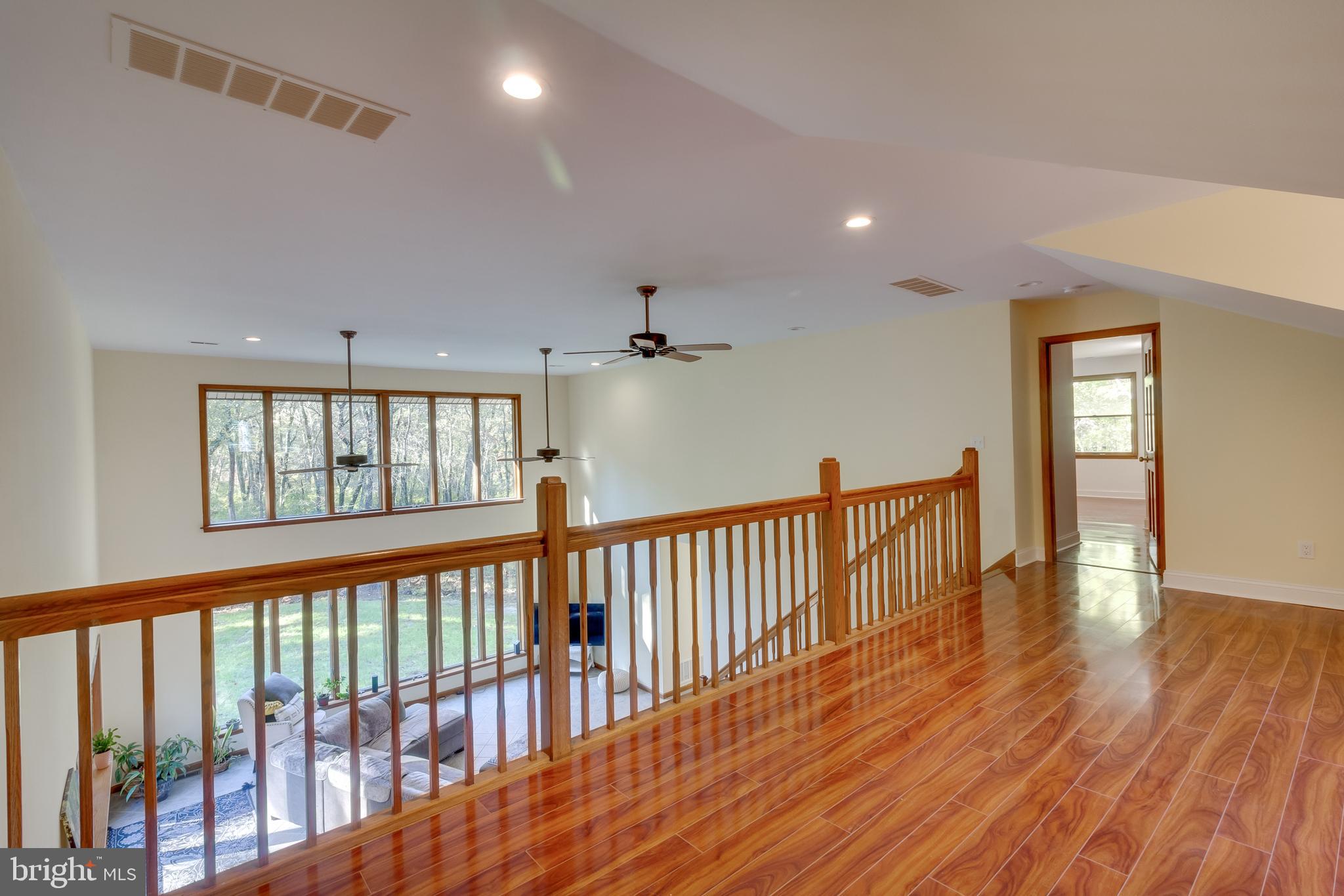 83 Grassy Lake Road Shamong, NJ 08088 - Photo 36 of 48 a view of a hallway with wooden floor and windows