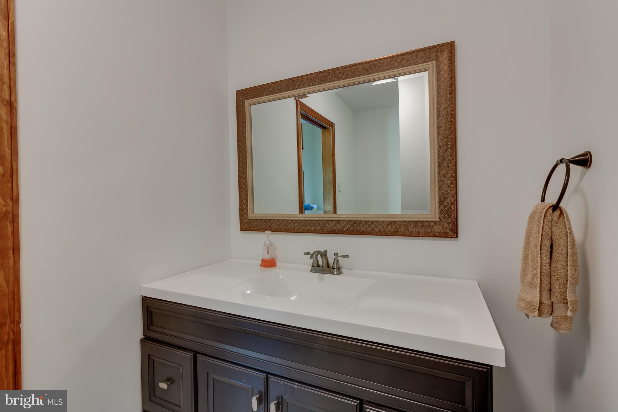 83 Grassy Lake Road Shamong, NJ 08088 - Photo 42 of 48 a bathroom with a sink and a mirror