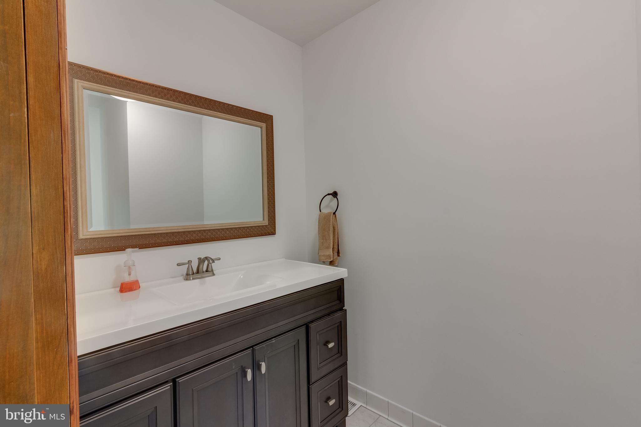 83 Grassy Lake Road Shamong, NJ 08088 - Photo 43 of 48 a bathroom with a sink vanity and a mirror