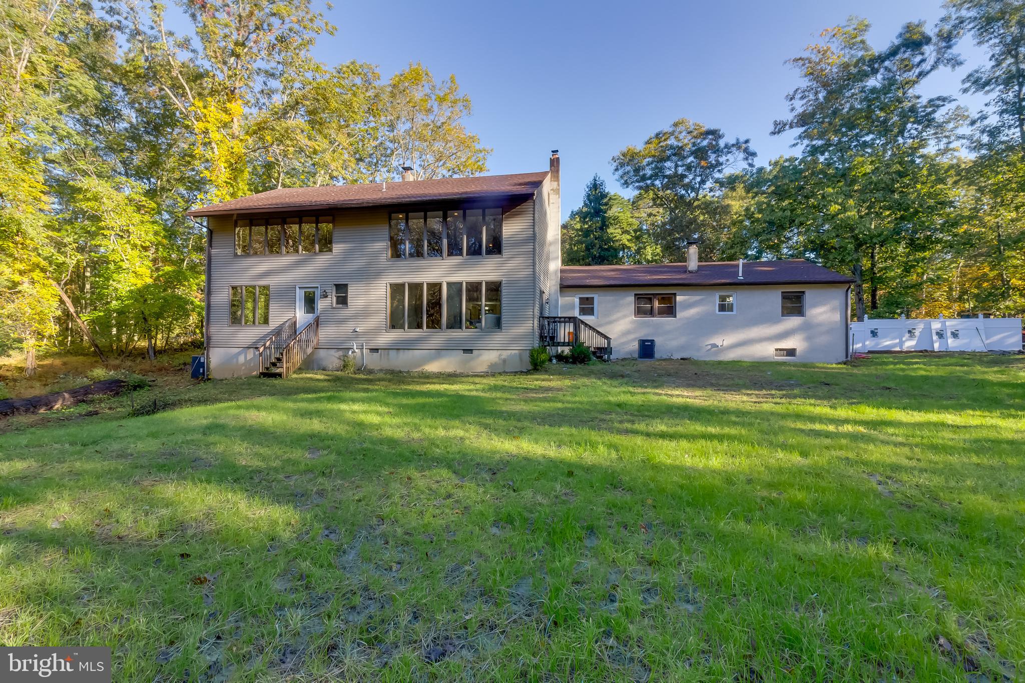 83 Grassy Lake Road Shamong, NJ 08088 - Photo 47 of 48 a view of a house with a yard deck and sitting area