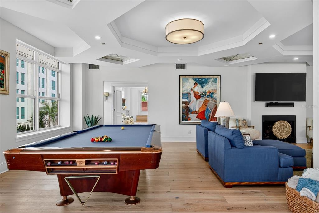 1330 Main Street, Unit 3 Sarasota, FL 34236 - Photo 12 of 73 a living room with furniture flat screen tv and a fireplace