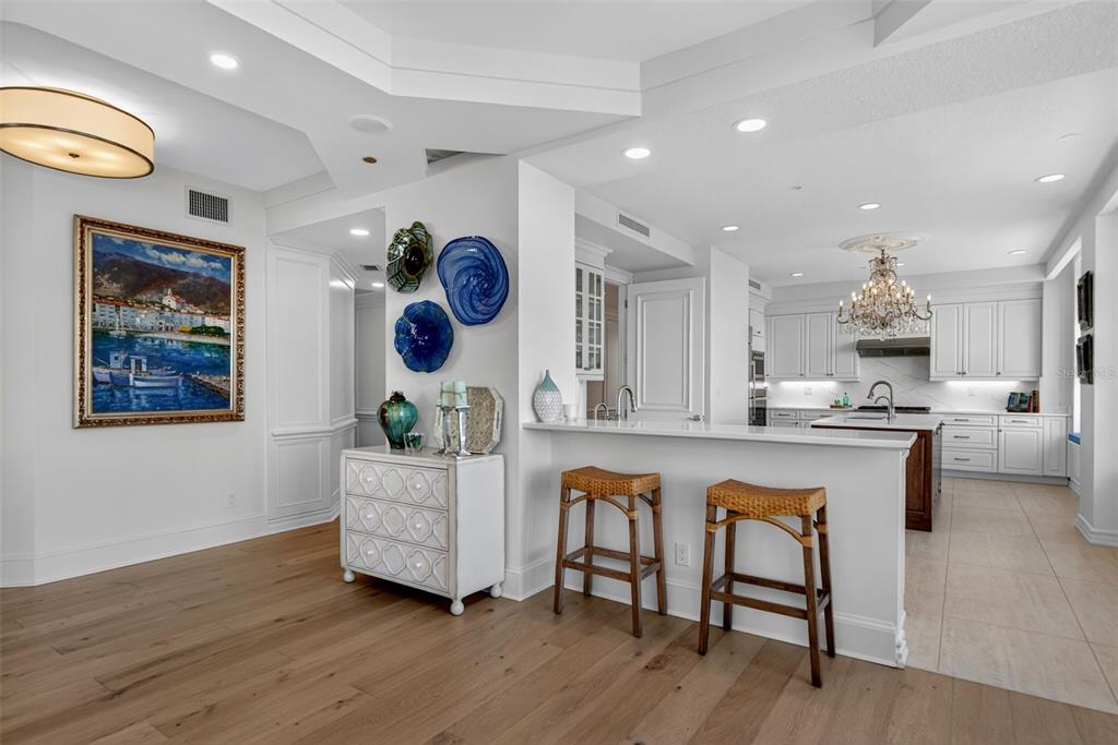 1330 Main Street, Unit 3 Sarasota, FL 34236 - Photo 18 of 73 a living room with kitchen island furniture and a wooden floor