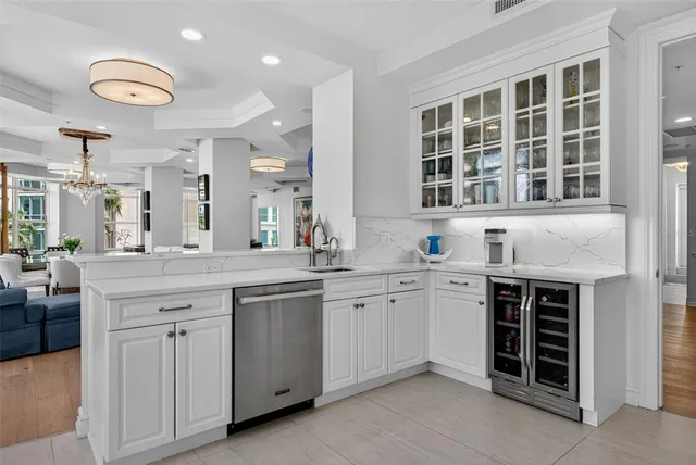 a kitchen with stainless steel appliances granite countertop a sink and cabinets