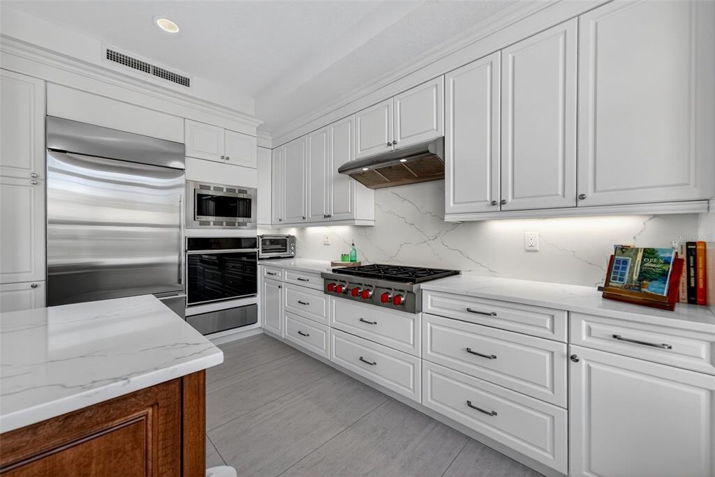 1330 Main Street, Unit 3 Sarasota, FL 34236 - Photo 27 of 73 a kitchen with white cabinets and appliances