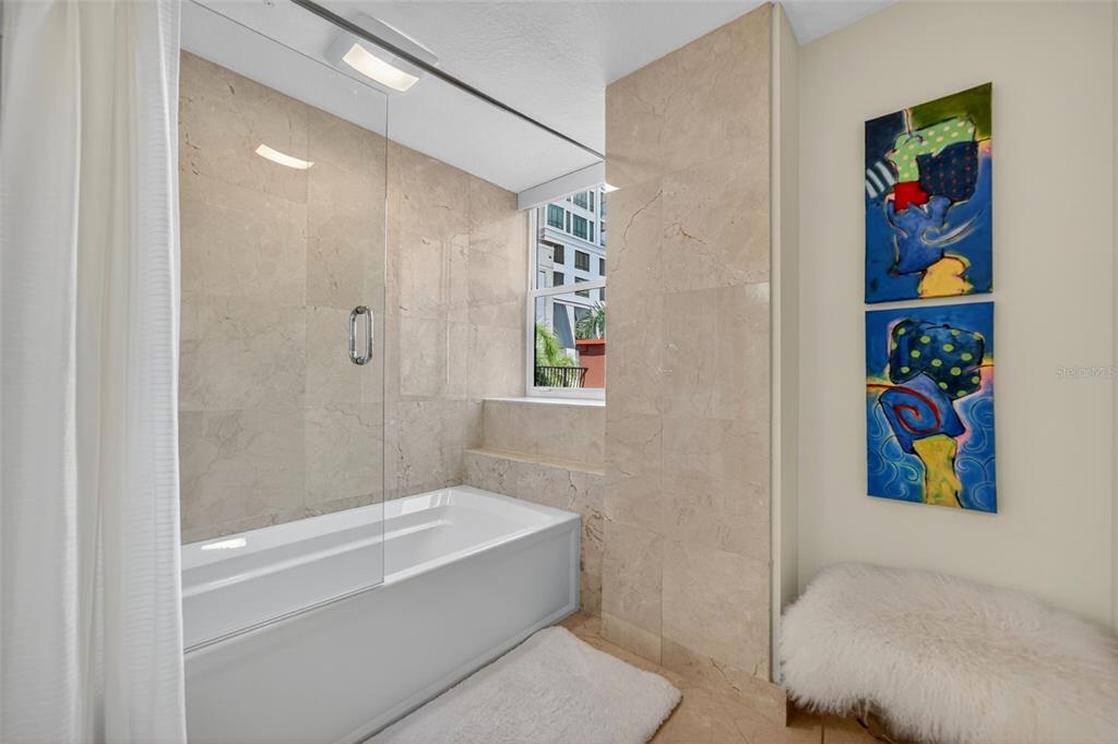 1330 Main Street, Unit 3 Sarasota, FL 34236 - Photo 40 of 73 a bathroom with a bathtub and a shower