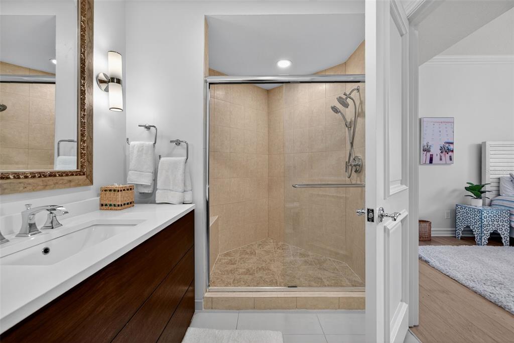 1330 Main Street, Unit 3 Sarasota, FL 34236 - Photo 46 of 73 a bathroom with a granite countertop sink mirror and shower