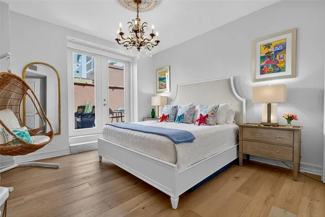 an aerial view of a multi story residential apartment building with yard and outdoor seating