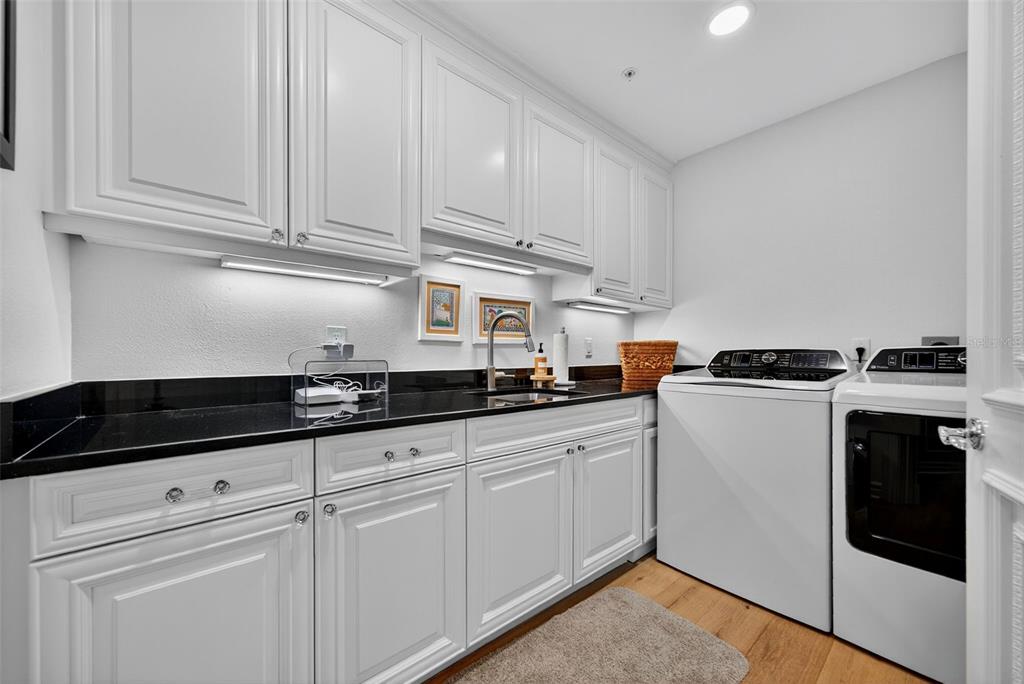 1330 Main Street, Unit 3 Sarasota, FL 34236 - Photo 50 of 73 a kitchen with granite countertop white cabinets and white appliances