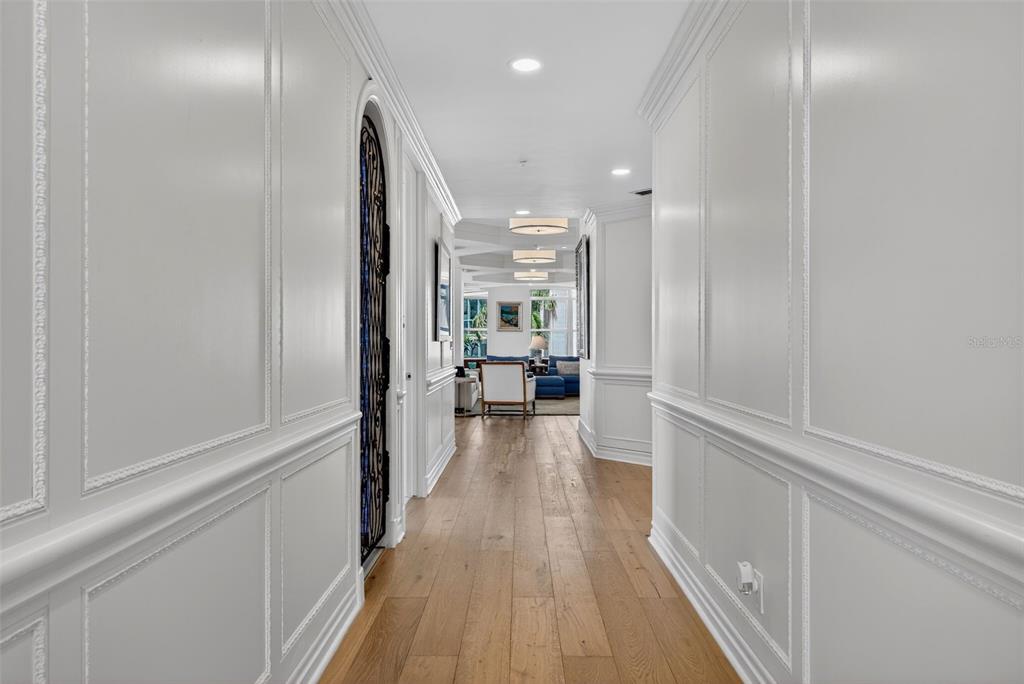 1330 Main Street, Unit 3 Sarasota, FL 34236 - Photo 6 of 73 a view of a hallway with wooden floor and staircase