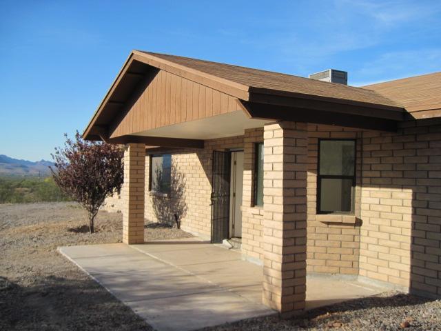 170 Vereda Cabrilla Lane Rio Rico, AZ 85648 - Photo 3 of 5 a front view of a house with a garden