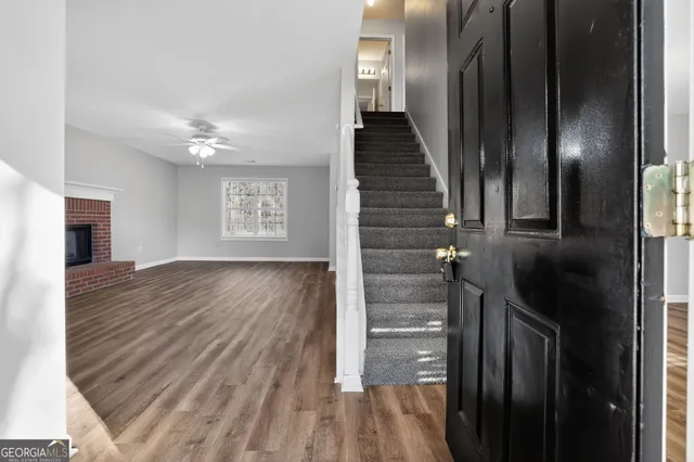 a view of entryway with wooden floor