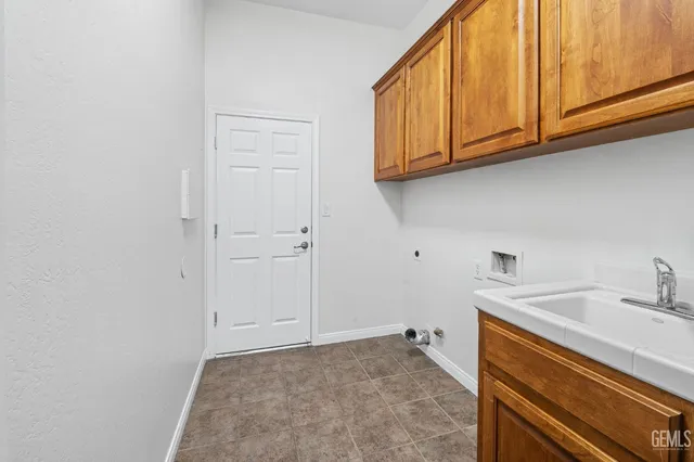 a view of a kitchen with sink and dishwasher