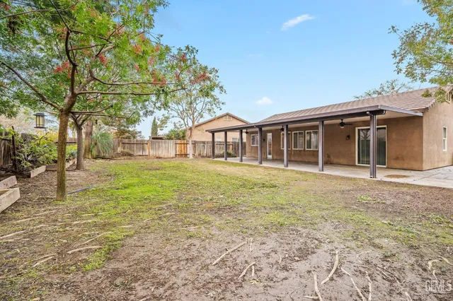 a house with trees in the background