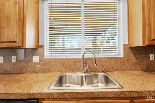 a kitchen with a sink and a window