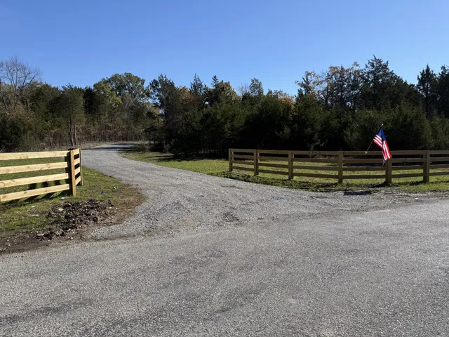a view of outdoor space with garden and trees