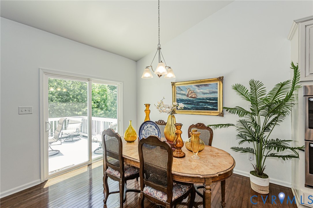 7435 Wicks Road Williamsburg, VA 23188 - Photo 24 of 82 Dining area with rich wood-finish flooring, a vaul
