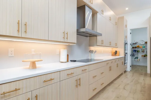 a spacious bedroom with a bed and large window