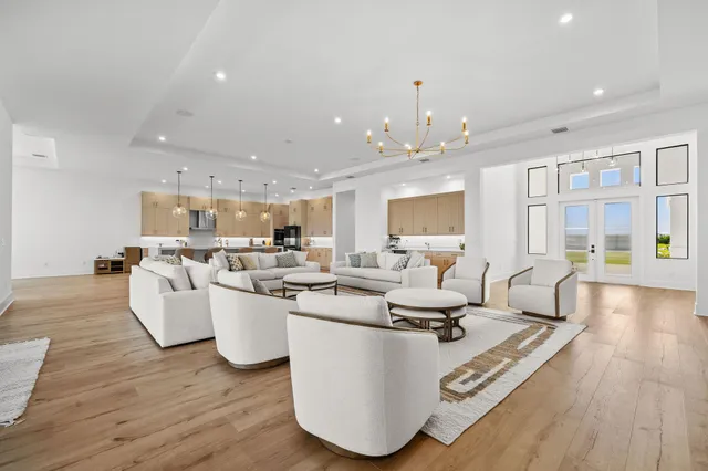 a spacious bathroom with a double vanity sink a mirror and a bathtub