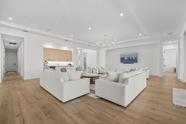 a large bathroom with a double vanity sink a large mirror and a shower