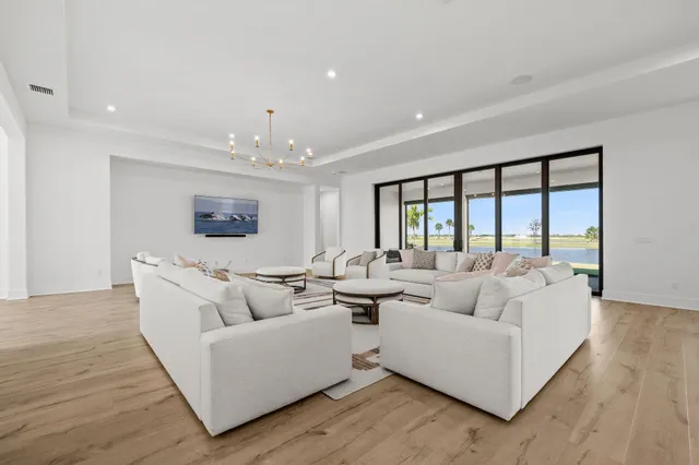 a room with gym equipment and wooden floor