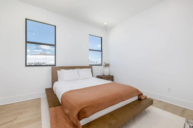 an aerial view of a house with a swimming pool yard and outdoor seating