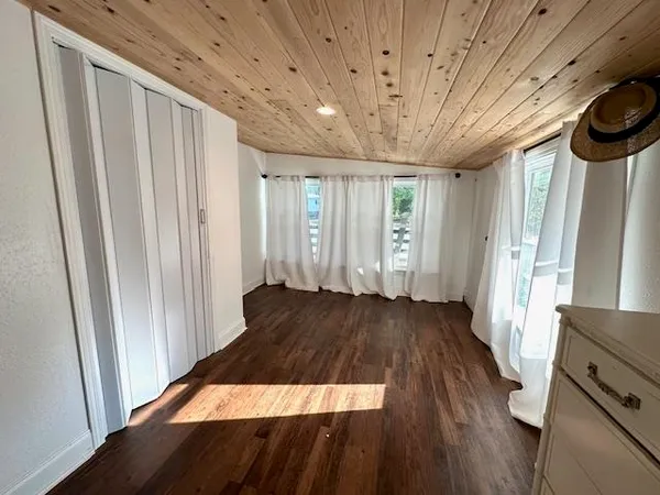 a view of a room with wooden floor and stairs