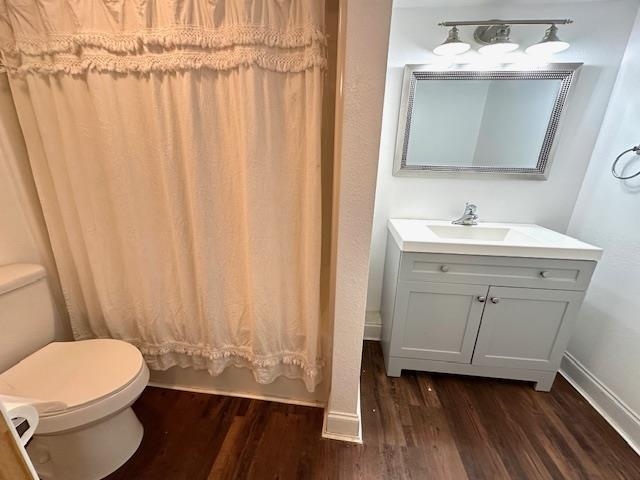 70 Point Way Saltillo, TN 38370 - Photo 25 of 36 Bathroom with hardwood / wood-style flooring, toilet, and vanity